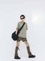 Minifalda vaquera con detalle de cinturón y calentadores de piernas