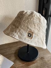 Ruched bucket hat with embroidered letters