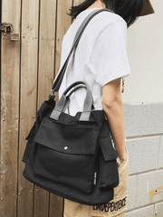 Bolso grande de lona con bolsillo para el hombro.