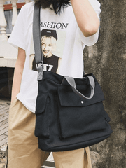 Bolso grande de lona con bolsillo para el hombro.