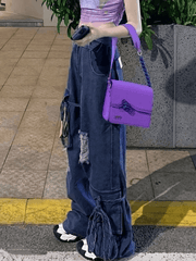 Ripped boyfriend jeans with tie belt