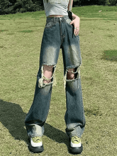 Faded straight jeans with ripped knees