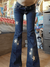 Flared jeans embroidered with stars