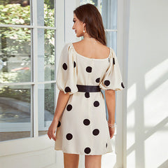 Vestido con mangas abullonadas y lunares de Real Shot