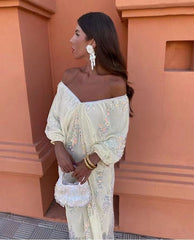 Vestido largo popular con escote en V profundo y lentejuelas y mangas de murciélago