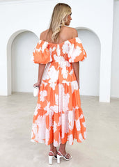 Elegante estampado floral con hombros descubiertos y mangas abullonadas