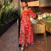 Vestido largo elegante con hombros descubiertos, media manga abullonada y abertura alta