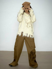 Schulterfreier Strickpullover im Distressed-Look