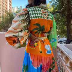 Cárdigan estampado con cordones y grafiti, dobladillo ancho y manga larga.