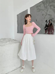 Top corto con lazo y hombros abullonados