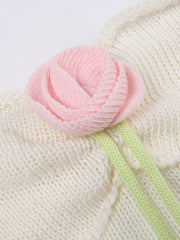 Top corto de punto con detalles de rosas