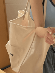 Bolso de mano con bolsillo y estampado de letras