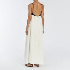 Vestido largo francés sin espalda con tirantes y contraste de color blanco y negro