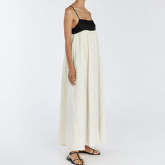 Vestido largo francés sin espalda con tirantes y contraste de color blanco y negro