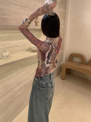 Top vintage con cordones y detalles de piel sintética