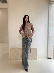 Top vintage con cordones y detalles de piel sintética