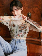 Top transparente con símbolos vintage