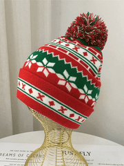 Knitted Christmas hat with jacquard pompoms