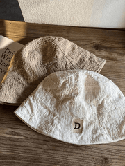 Ruched bucket hat with embroidered letters