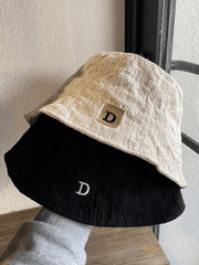 Ruched bucket hat with embroidered letters
