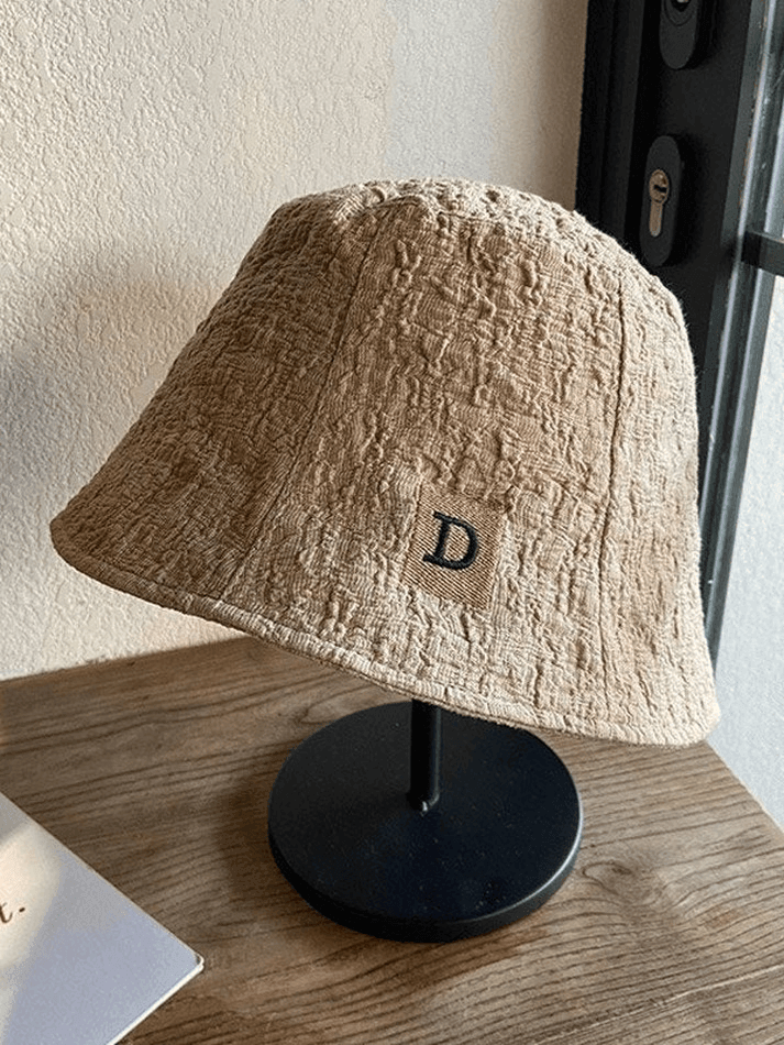 Ruched bucket hat with embroidered letters