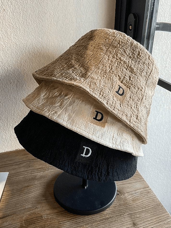Ruched bucket hat with embroidered letters