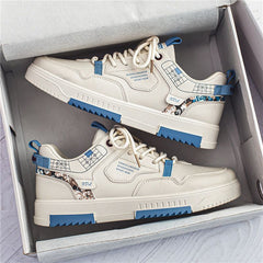 Zapatos deportivos casuales blancos de caña baja