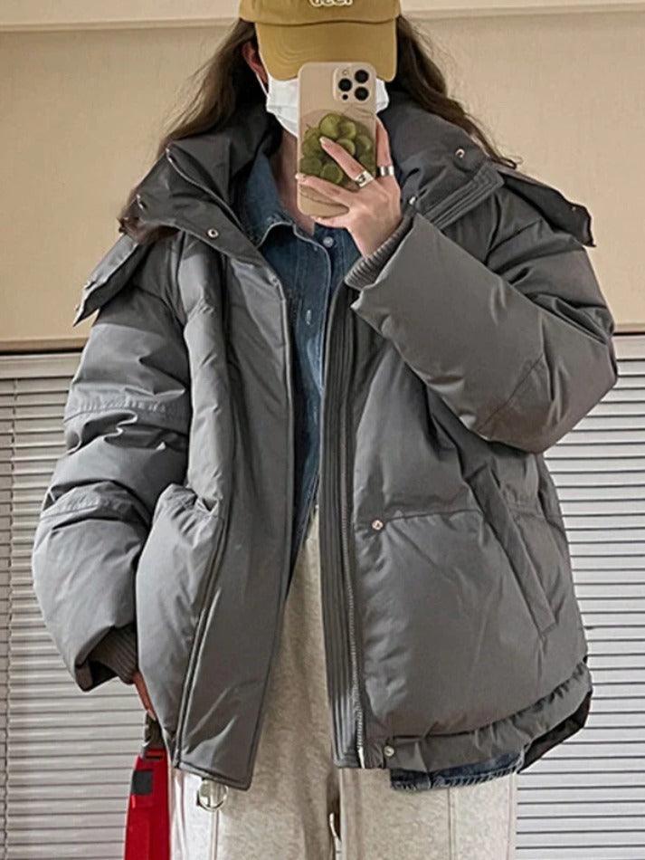 Pufferjacke mit Kapuze und Herzverzierung