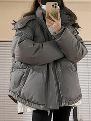 Pufferjacke mit Kapuze und Herzverzierung