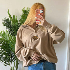 Sweatshirt mit Knopfleiste und Sonnenstickerei