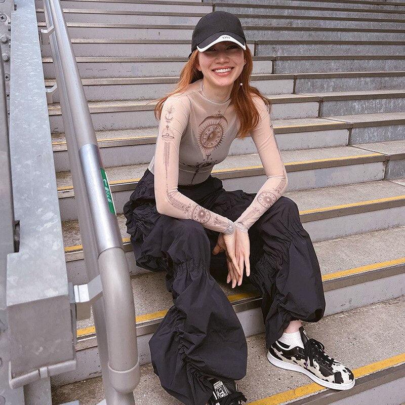 Top de malla con gráfico del zodiaco
